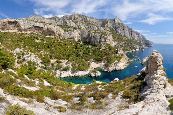 Panoramic view of the calanque of Sugiton, high cliffs, and la Grande Candelle