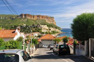 Road in Cassis and view on the Cap Canaille